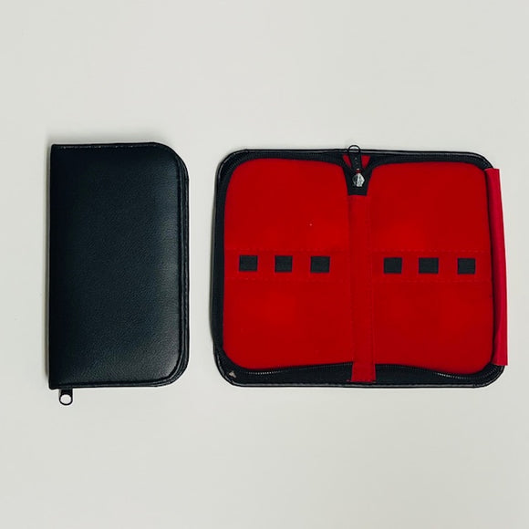 Black tweezer storage case with red velvet interior and elestatic straps to secure tweezers. Zips closed for protective storage